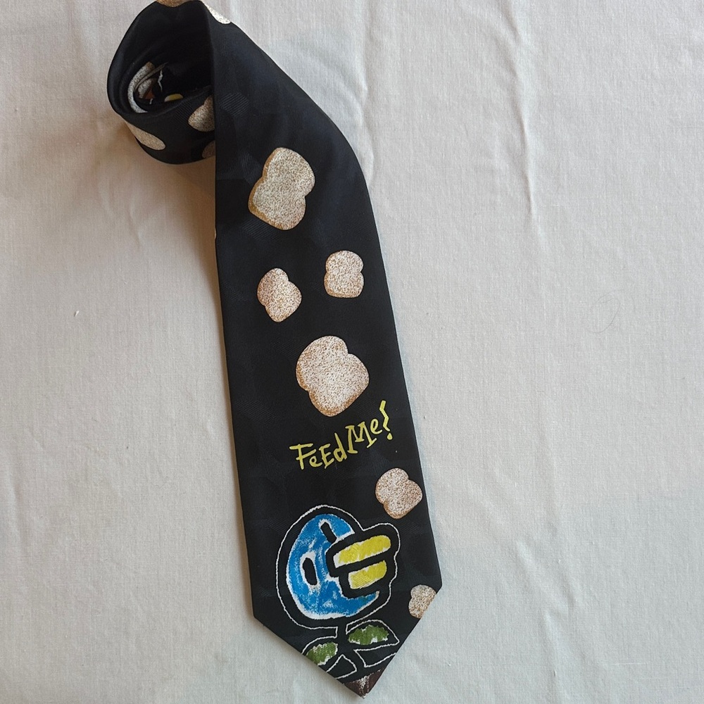 Tamagotchi 1997 Black Tie with Bread and Bird Design